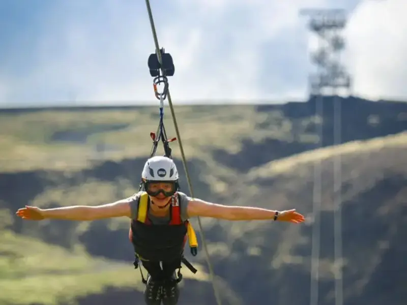 A visitor riding the Mega Zipline near Hveragerði
