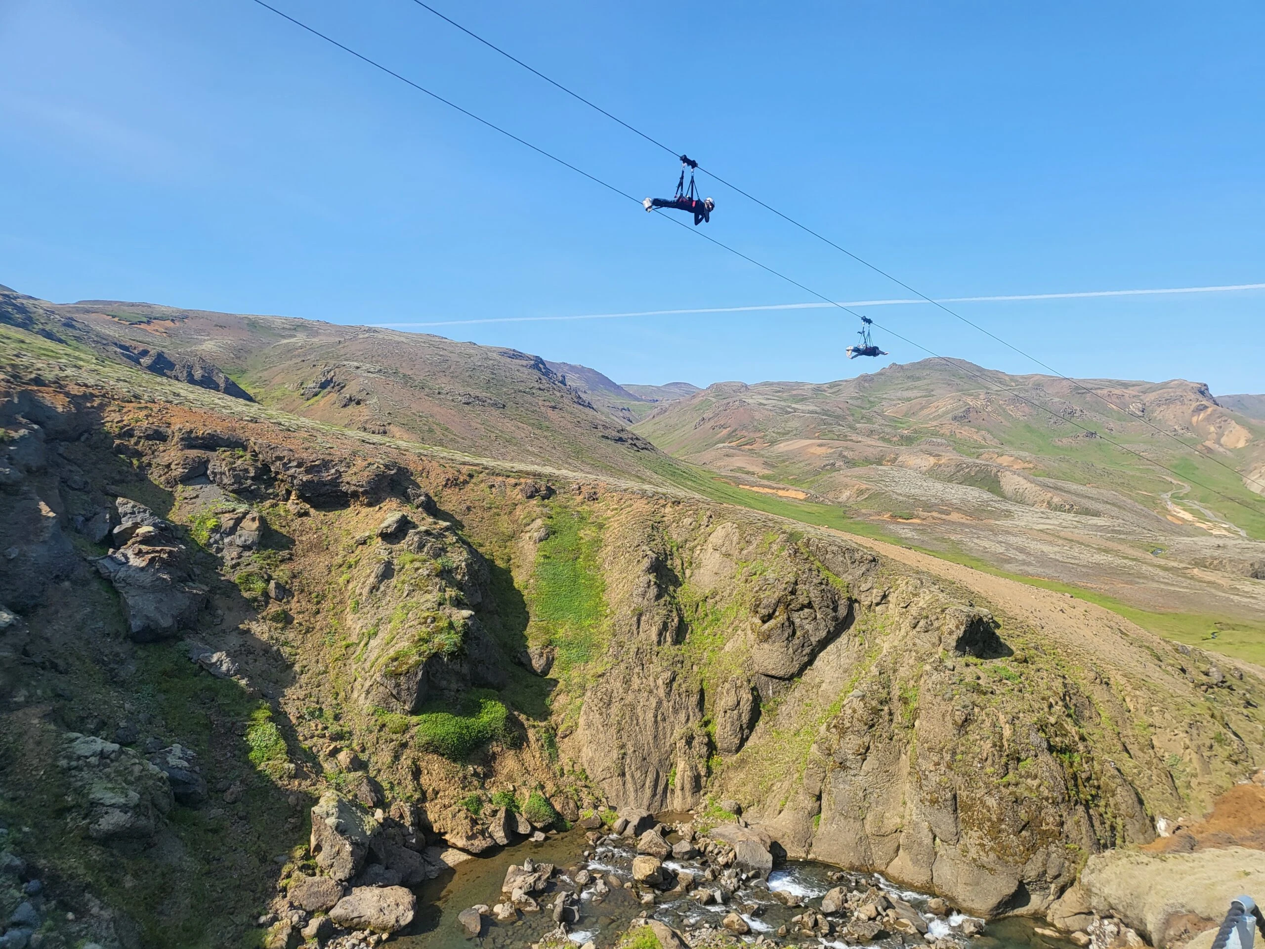 Visitors flying above the canyon on Mega Zipline near Hveragerði